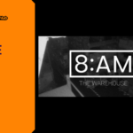 Promotional banner for the psychological surveillance horror game 8AM: The Warehouse by GameLaunchHub, featuring the official game logo overlaid on a grainy, black-and-white security camera feed of a dark warehouse.